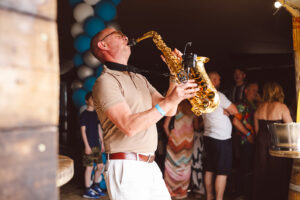 saxophonist Mark playing at the TWD 15 year party